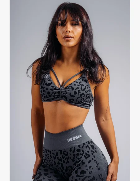 NEBBIA Medium support sports bra with leopard pattern PRIMAL black