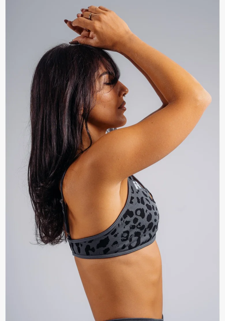 NEBBIA Medium support sports bra with leopard pattern PRIMAL black