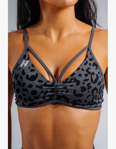 NEBBIA Medium support sports bra with leopard pattern PRIMAL black
