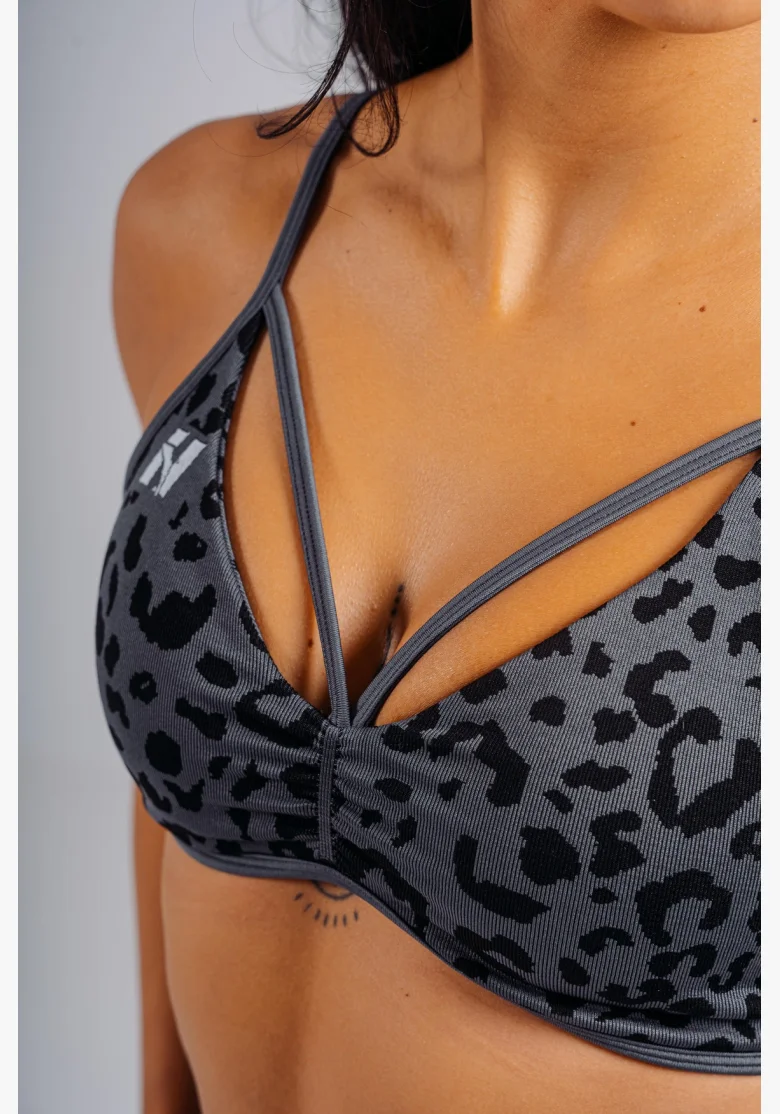 NEBBIA Medium support sports bra with leopard pattern PRIMAL black