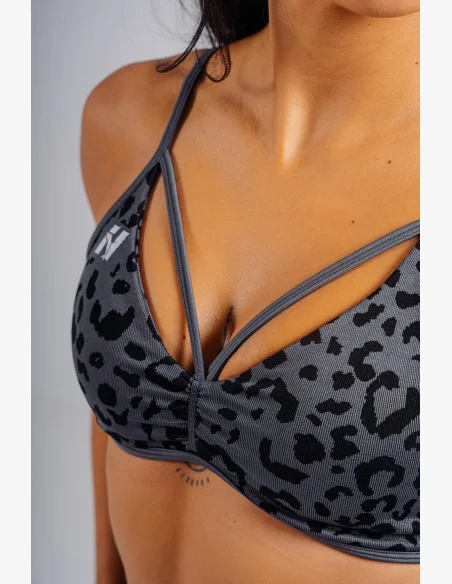 NEBBIA Medium support sports bra with leopard pattern PRIMAL black