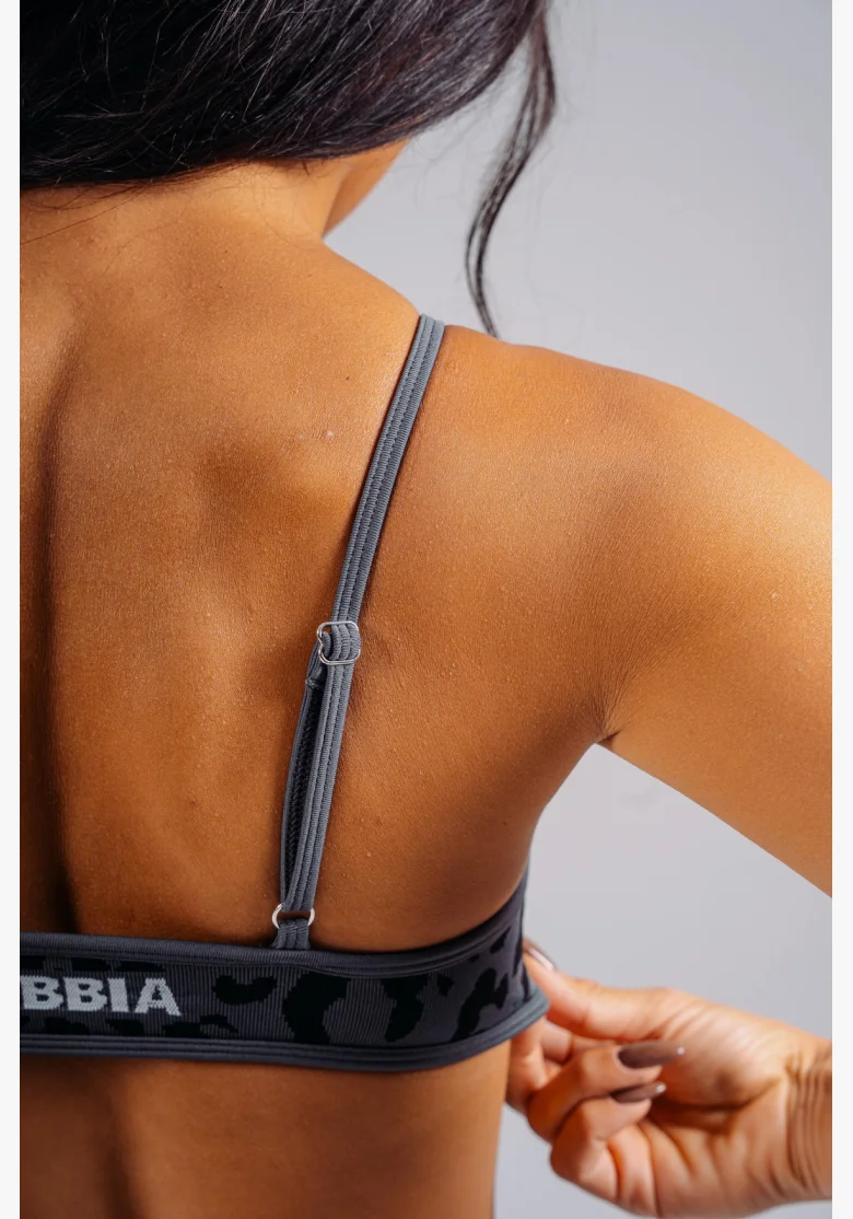 NEBBIA Medium support sports bra with leopard pattern PRIMAL black