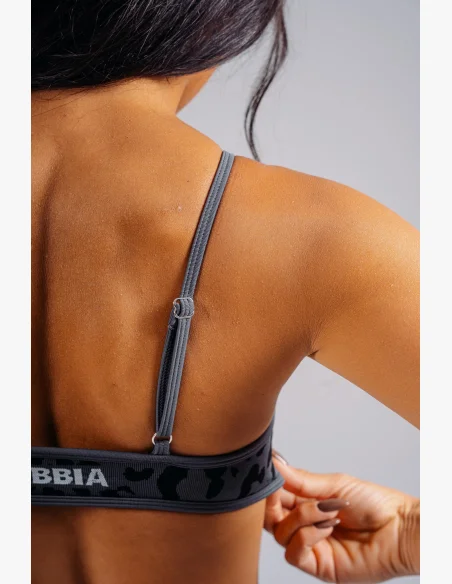 NEBBIA Medium support sports bra with leopard pattern PRIMAL black