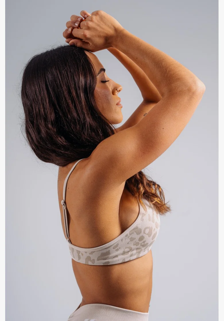 NEBBIA Medium support sports bra with leopard pattern PRIMAL cream