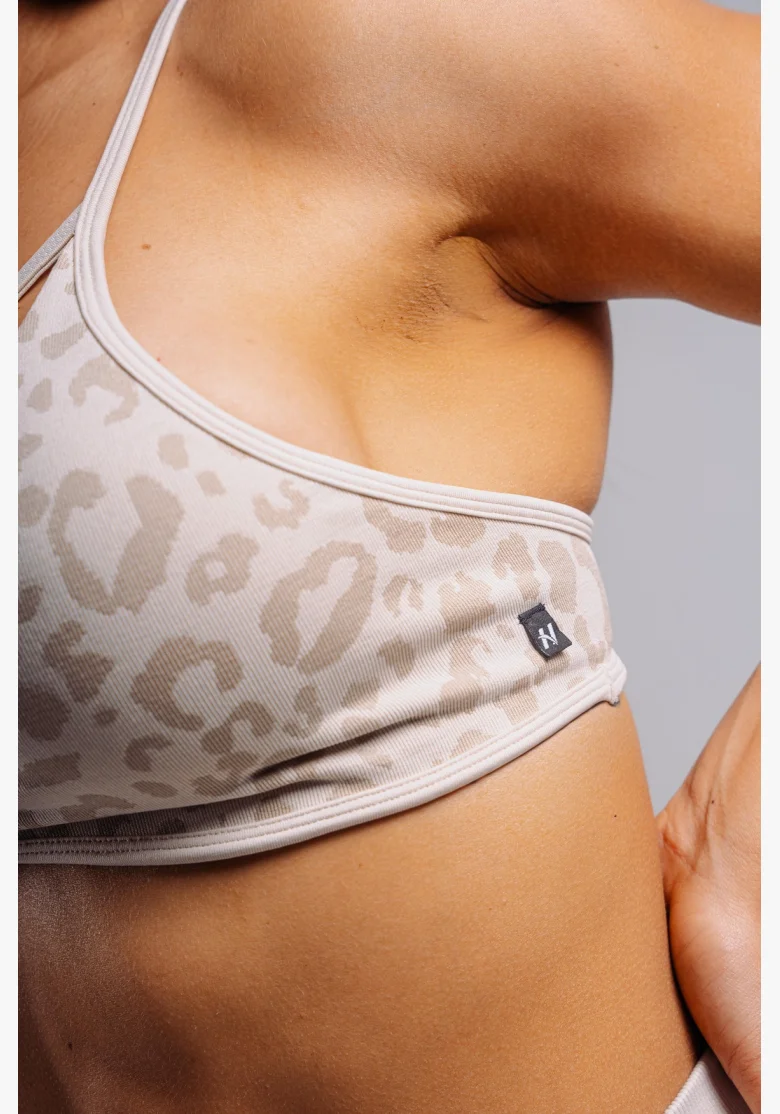 NEBBIA Medium support sports bra with leopard pattern PRIMAL cream