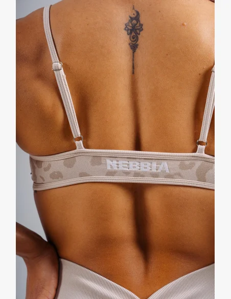 NEBBIA Medium support sports bra with leopard pattern PRIMAL cream