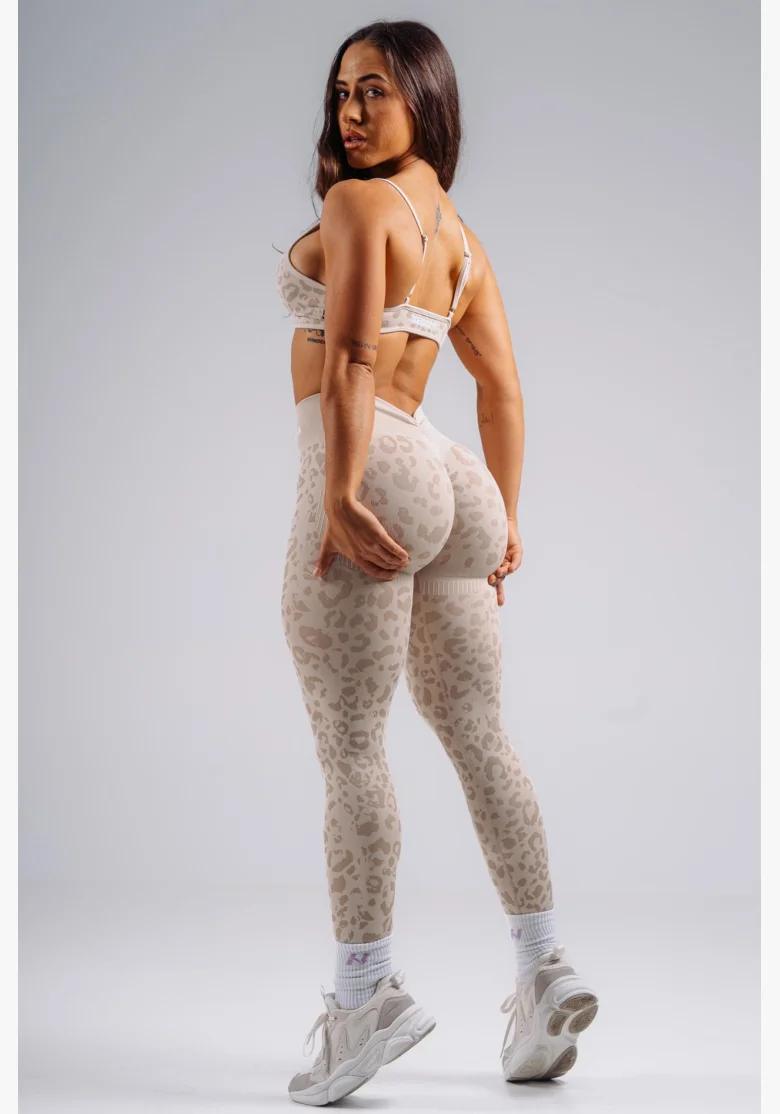 NEBBIA Medium support sports bra with leopard pattern PRIMAL cream
