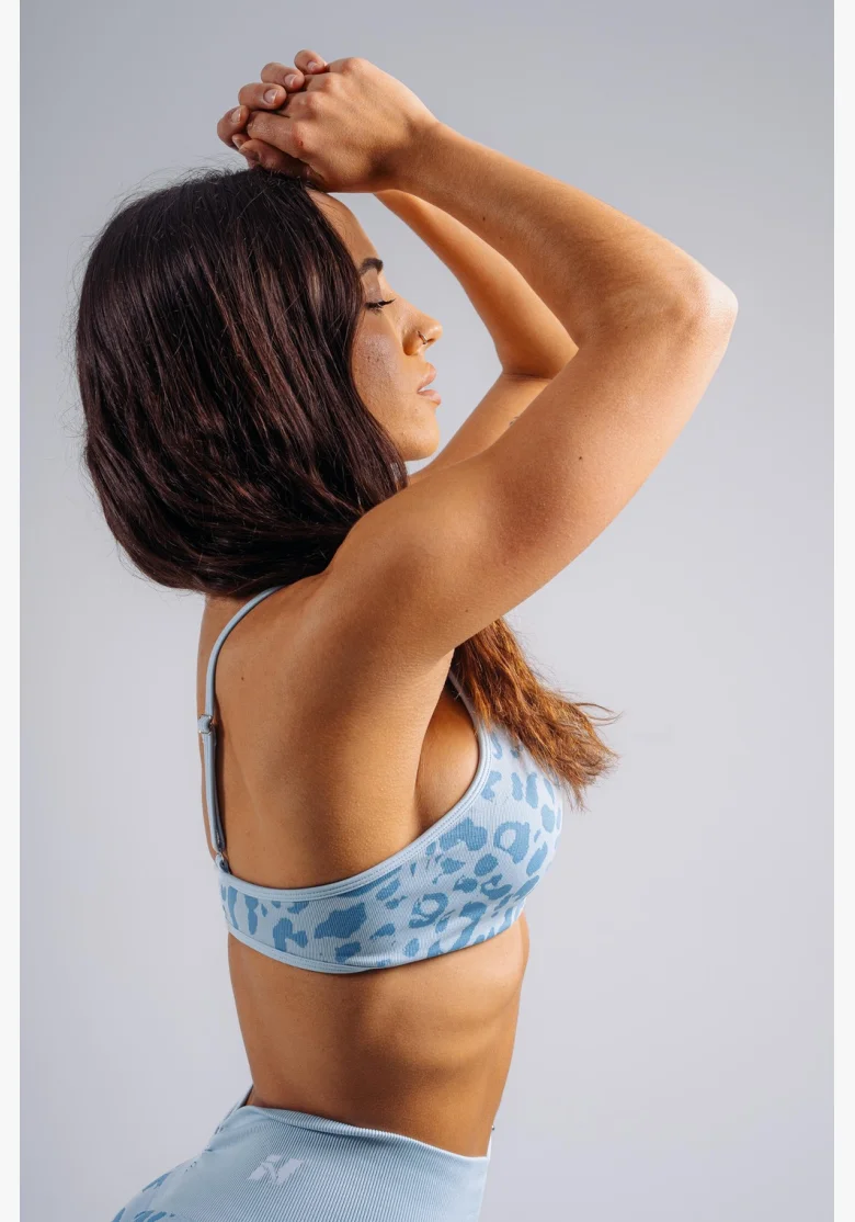 NEBBIA Medium support sports bra with leopard pattern PRIMAL blue