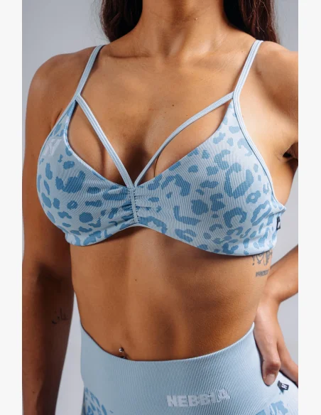 NEBBIA Medium support sports bra with leopard pattern PRIMAL blue