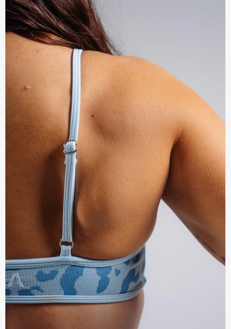 NEBBIA Medium support sports bra with leopard pattern PRIMAL blue