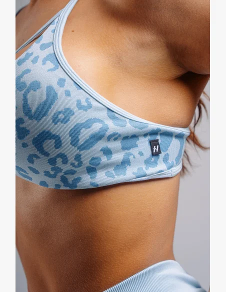NEBBIA Medium support sports bra with leopard pattern PRIMAL blue